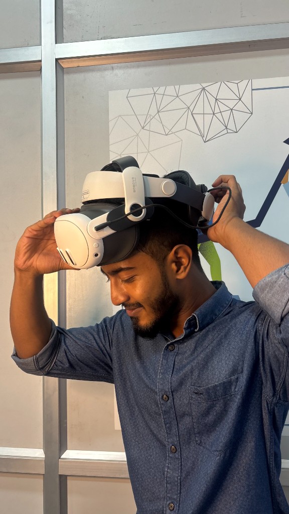 Student fitting a VR headset before simulator training at Hawking Drone School